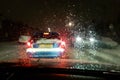 In car view of snow fall storm in the UK causes traffic congestion at night