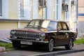 car Volga GAZ 2410 parked in a city yard. Shiny retro car gaz-2410, front side view