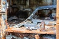 The car was completely destroyed by fire. Abandoned, burnt and rusty car by the road. Cars were on fire in the parking lot. War of Royalty Free Stock Photo