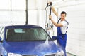 car wash as service/ after-sales service by mechanics in a garage/ car dealership