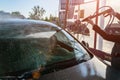 Car wash, clean foam service. Wax vehicle. Hand carwash with water and soap. Auto cleaner station. Care with pressure Royalty Free Stock Photo