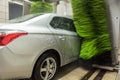 Car wash. Cleaning high-pressure water cars and foam in the washing station Royalty Free Stock Photo