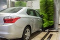 Car wash. Cleaning high-pressure water cars and foam in the washing station Royalty Free Stock Photo