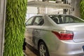 Car wash. Cleaning high-pressure water cars and foam in the washing station Royalty Free Stock Photo