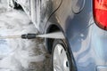 Car Wash Closeup. Washing Car by High Pressure Water Royalty Free Stock Photo