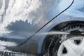 Car Wash Closeup. Washing Car by High Pressure Water Royalty Free Stock Photo