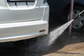 Car Wash Closeup. Washing Car by High Pressure Water Royalty Free Stock Photo