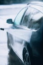 Car wash. The process of washing a car with a high-pressure foam jet.