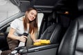 Car wash service, girl worker cleaning spray eco interior modern microfiber and console auto Royalty Free Stock Photo