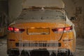 Car wash at service station. Yellow car in foam. Car getting a wash with soap. Royalty Free Stock Photo