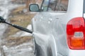 Car wash. Wash the car with high water pressure. High water pressure on the car. Royalty Free Stock Photo