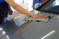 Car washer man hand wiping and polishing car