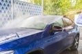 Car Washing. Cleaning Car Using High Pressure Water Royalty Free Stock Photo