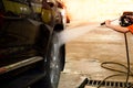 Car Washing. Cleaning Car Using High Pressure Water.