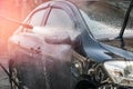 Car Washing. Cleaning Car Using High Pressure Water Royalty Free Stock Photo