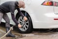 Car washing using high pressure water jet.