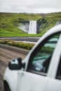 Car on the way to famous Skogafoss waterfall in Iceland. Golden circle landmark. Royalty Free Stock Photo