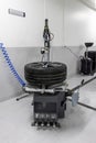 Car wheel balancing service. Car wheel balancing in tire service. Mechanic working with wheel balancing machine at tire service,