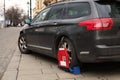 Car wheel clamp Locked illegally parked cars Car wheel blocked by wheel lock because of illegal parking violation. Wheel Royalty Free Stock Photo