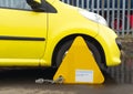 Car wheel clamped at restricted parking area