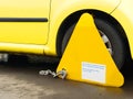 Car wheel clamped at restricted parking area
