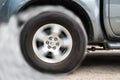 Car wheel drifting and smoking on track dark edition Royalty Free Stock Photo