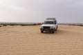 A car wheel that is embedded in the sand in the Douz Royalty Free Stock Photo