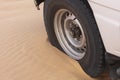 A car wheel that is embedded in the sand in the Douz Royalty Free Stock Photo