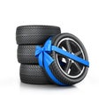 Car Wheel enveloped in a blue ribbon and bow Royalty Free Stock Photo