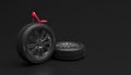 Car wheel and red female shoe on a black background. Creative conceptual illustration. Copy space for text or logo. 3D rendering Royalty Free Stock Photo