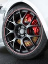 Car wheel with red-hot brakes Royalty Free Stock Photo