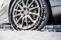 Car wheel in the snow . Driving in winter concept, ai generated