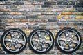 Car wheels on brick background. Copy space. Transport. Spare parts. Royalty Free Stock Photo