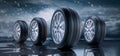 Row of car wheels and tires in the rain Royalty Free Stock Photo