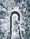 Car on winding winter road as seen from above Royalty Free Stock Photo