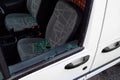 Car window broken by criminals and items stolen from the seat.