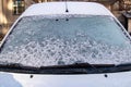 Car window covered with snow. After snowfall Royalty Free Stock Photo