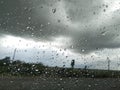 Car window Glass Rain drops nature view on the way Royalty Free Stock Photo