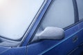 Car window and side mirror covered with ice in the Royalty Free Stock Photo