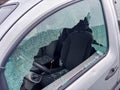 Car window smashed as a result of an act of vandalism Royalty Free Stock Photo