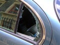 Car window smashed outside house Royalty Free Stock Photo