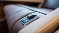 Car window switch. integrated button control on luxury vehicle leather interior Royalty Free Stock Photo