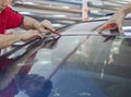 Car window tinting specialist trimming front car windscreen vinyl tinting film using cuter