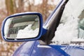 Car windshield and mirror covered snow. Winter problems Royalty Free Stock Photo