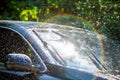 Car windshield with rain drops and frameless wiper blade Royalty Free Stock Photo