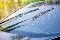 Car windshield with rain drops and frameless wiper blade Royalty Free Stock Photo