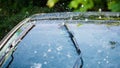 Car windshield with rain drops and frameless wiper blade Royalty Free Stock Photo