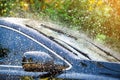 Car windshield with rain drops and frameless wiper blade Royalty Free Stock Photo