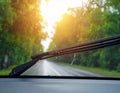 Generated image Car windshield with rain drops and frameless wiper blade closeup Royalty Free Stock Photo