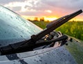 Generated image Car windshield with rain drops and frameless wiper blade closeup Royalty Free Stock Photo
